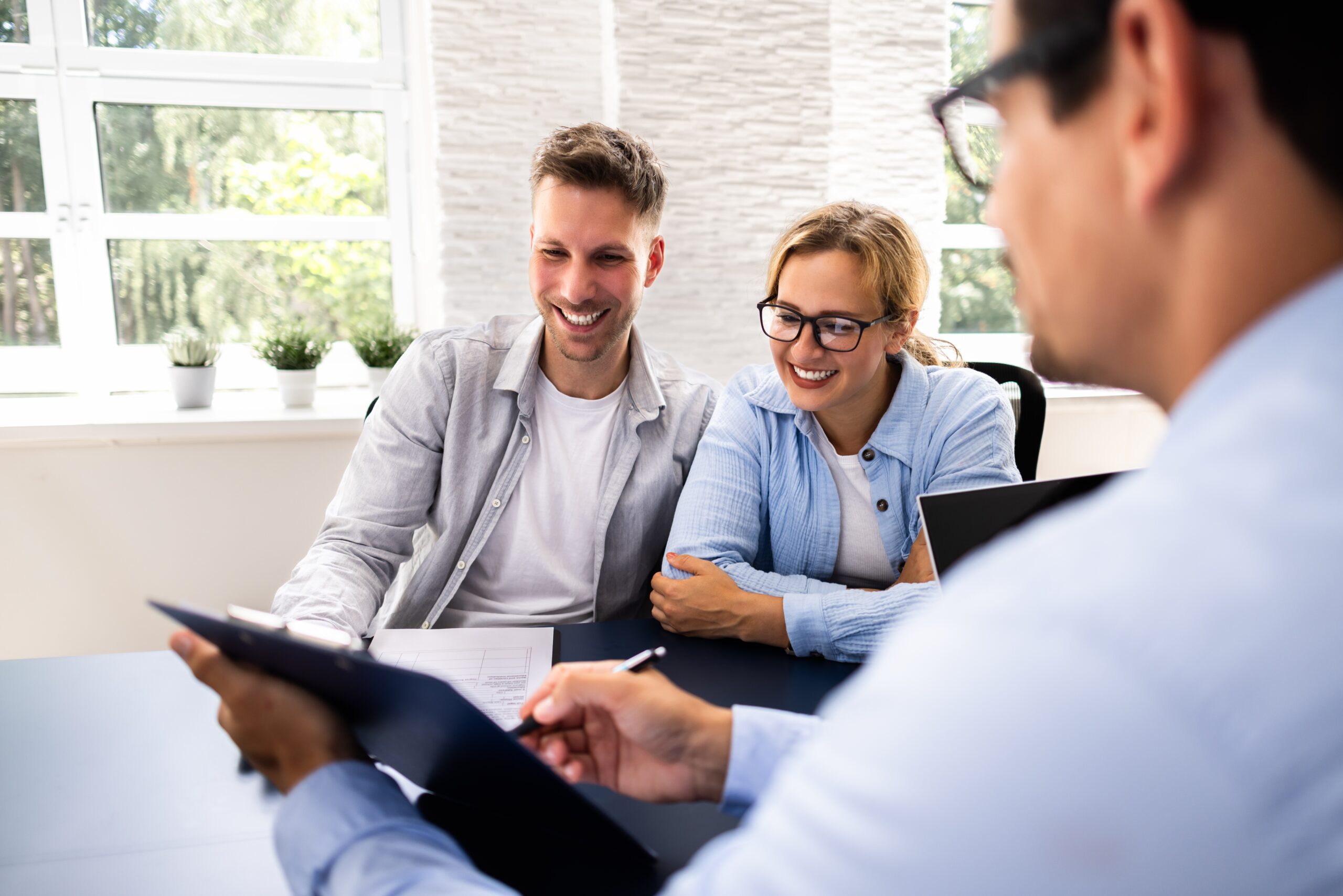 Couple reviewing their estate plan with a lawyer.